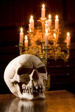 5601603-spooky-skull-lit-by-candles-in-a-chapel